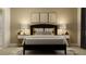 Modern bedroom with neutral decor, wall art, and accent lighting at 9645 Runaway Breeze Dr, Land O Lakes, FL 34637