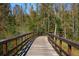 Inviting boardwalk winding through a lush, natural landscape offering residents a scenic walking experience at 9645 Runaway Breeze Dr, Land O Lakes, FL 34637