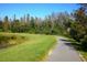 Scenic path featuring natural pond areas, enhancing the recreational experience at 9645 Runaway Breeze Dr, Land O Lakes, FL 34637