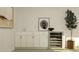 Modern wet bar with sleek cabinetry, countertop, wine cooler, and stylish decor at 9645 Runaway Breeze Dr, Land O Lakes, FL 34637