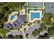 Aerial view of community amenities including pools, tennis courts, and a clubhouse at 10141 Deercliff Dr, Tampa, FL 33647