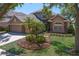 Charming two-story home with well-manicured lawn and inviting curb appeal, set under a clear blue sky at 10141 Deercliff Dr, Tampa, FL 33647