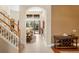 Bright foyer with tile flooring, showcasing an open floor plan leading to a living area with pool views at 10141 Deercliff Dr, Tampa, FL 33647