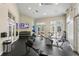 Bright gym with lots of equipment, mirrors, ceiling fans, and lots of natural light at 10141 Deercliff Dr, Tampa, FL 33647