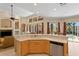 Open kitchen with stainless steel appliances, bar seating, a ceiling fan, and a great view to the back patio at 10141 Deercliff Dr, Tampa, FL 33647