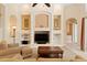 Spacious living room with built-in shelving, a modern entertainment center, and comfortable seating at 10141 Deercliff Dr, Tampa, FL 33647