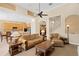 Open floor plan shows a living room with a ceiling fan, high ceiling, and staircase near the kitchen at 10141 Deercliff Dr, Tampa, FL 33647