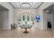Clubhouse lobby featuring a chandelier, a seating area, and large windows that offer natural light at 10141 Deercliff Dr, Tampa, FL 33647