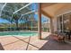 Enjoy the beautiful screened-in pool and patio area, perfect for relaxing and entertaining at 10141 Deercliff Dr, Tampa, FL 33647