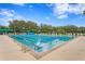 Long pool with lane lines for lap swimming and an outdoor seating area at 10141 Deercliff Dr, Tampa, FL 33647