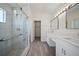 Elegant bathroom featuring a glass-enclosed shower, dual sinks, and modern finishes at 10503 Dotham Ct, Tampa, FL 33626