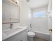 Classic bathroom with tub-shower combination, white tile, and stylish vanity at 10503 Dotham Ct, Tampa, FL 33626