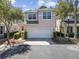 Two-story home featuring an attached two-car garage, manicured landscaping, and neutral stucco exterior at 10503 Dotham Ct, Tampa, FL 33626
