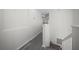 Hallway featuring new hard wood floors, stairs, and fresh white paint at 10503 Dotham Ct, Tampa, FL 33626
