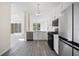 Bright kitchen featuring new stainless appliances, an open floor plan, and new flooring at 10503 Dotham Ct, Tampa, FL 33626