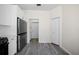 Bright kitchen featuring new stainless appliances, white cabinets, pantry and wood floors at 10503 Dotham Ct, Tampa, FL 33626