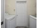 Laundry room featuring washer and dryer hookups with white door at 10503 Dotham Ct, Tampa, FL 33626