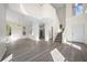 Open concept living room with hardwood floors, staircase, and lots of natural light at 10503 Dotham Ct, Tampa, FL 33626