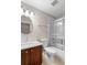 Bathroom featuring a vanity with modern sink, toilet, and a shower with glass doors at 1112 Jasmine Creek Ct, Sun City Center, FL 33573