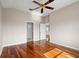 Spacious bedroom features beautiful wood flooring and a ceiling fan at 1112 Jasmine Creek Ct, Sun City Center, FL 33573