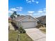 Charming one-story home featuring a two-car garage, well-maintained landscaping, and a welcoming driveway at 1112 Jasmine Creek Ct, Sun City Center, FL 33573