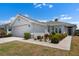 Well-maintained single Gathering home with manicured landscaping and a two-car garage at 1112 Jasmine Creek Ct, Sun City Center, FL 33573