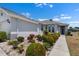 Beautiful single Gathering home with manicured landscaping and walkway leading to the front door at 1112 Jasmine Creek Ct, Sun City Center, FL 33573