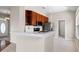 Kitchen with stainless steel appliances, bar seating, and bright white countertops at 1112 Jasmine Creek Ct, Sun City Center, FL 33573