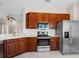 Bright kitchen features stainless steel appliances, modern cabinets, and white countertops at 1112 Jasmine Creek Ct, Sun City Center, FL 33573