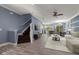Bright and airy living room with modern furnishings, wood floors, and an open floor plan at 11442 Crowned Sparrow Ln, Tampa, FL 33626