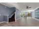Stylish open-concept living room flowing into the kitchen with hardwood floors and plenty of natural light at 11442 Crowned Sparrow Ln, Tampa, FL 33626