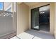 Exterior patio looking inside with sliding glass door and chandelier at 11442 Crowned Sparrow Ln, Tampa, FL 33626