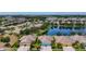 The aerial image displays homes located in a lakeside community with manicured lawns, close to shopping and recreation at 11457 Captiva Kay Dr, Riverview, FL 33569