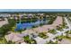 An aerial shot reveals the community's colorful homes situated around a lake, complete with well-maintained landscaping at 11457 Captiva Kay Dr, Riverview, FL 33569
