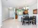 The dining area and kitchen flow into the living room with a harmonious layout at 11457 Captiva Kay Dr, Riverview, FL 33569