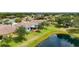 Beautiful single-story home featuring a screened lanai and a picturesque pond view from the expansive backyard at 11457 Captiva Kay Dr, Riverview, FL 33569