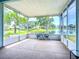 Enjoy tranquil lake views from this screened lanai with seating, offering the perfect spot to relax at 11457 Captiva Kay Dr, Riverview, FL 33569