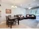 Living and dining area combo includes ceiling fan and backyard access at 11457 Captiva Kay Dr, Riverview, FL 33569
