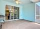 Exterior patio showing a grilling area with view into the living room through sliding glass doors at 11457 Captiva Kay Dr, Riverview, FL 33569