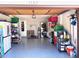 Well-organized garage with ample storage, a washer-dryer, and a clean epoxy floor at 1165 Falcon Dr, Dunedin, FL 34698