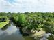 Lush, green trees and sparkling water show serene setting at 11783 Ashley Ct, Seminole, FL 33772