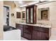 The bathroom features granite countertops, a dual sink vanity, and abundant natural light at 11783 Ashley Ct, Seminole, FL 33772