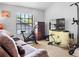 Bedroom featuring workout equipment, a TV, and natural light at 11783 Ashley Ct, Seminole, FL 33772