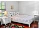 Bright bedroom boasts a plush rug and lots of natural light at 11783 Ashley Ct, Seminole, FL 33772