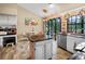 Charming kitchen with unique tile accents, modern appliances, and a cozy breakfast nook at 11783 Ashley Ct, Seminole, FL 33772