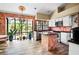 Well-lit kitchen with unique tile accents, modern appliances, and ample counter space at 11783 Ashley Ct, Seminole, FL 33772