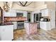 Bright kitchen featuring white cabinetry, stainless steel appliances, and a central island at 11783 Ashley Ct, Seminole, FL 33772