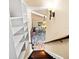 View from the top of the staircase shows an open floor plan and natural light at 11783 Ashley Ct, Seminole, FL 33772