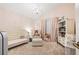 Charming Bedroom featuring a crib, plush chair, and bookshelf with soft, pastel colors at 11808 Lancashire Dr, Tampa, FL 33626