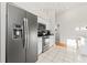 Bright kitchen with stainless steel appliances, white cabinets, and tile flooring offers a modern and clean space at 11808 Lancashire Dr, Tampa, FL 33626